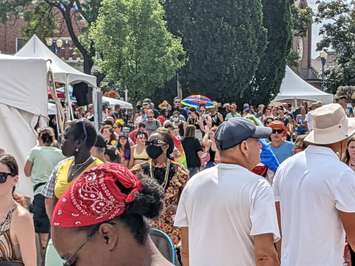 A crowd arrives at Lanspeary Park following the Windsor Essex PrideFest Parade, August 7, 2022. Photo by Mark Brown/WindsorNewsToday.ca.