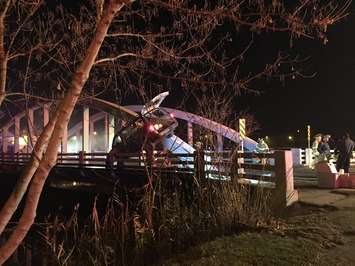 A vehicle collides with the River Canard bridge in Amherstburg, December 6, 2015. (Photo courtesy  @JPed024/Twitter)