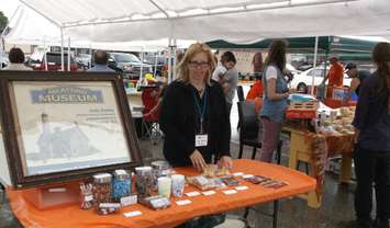 Co-ordinator Jody Seeley welcomes potential customers to Meaford Museum's first Flea Market at Market Square. (Photo by Jim Armstrong)