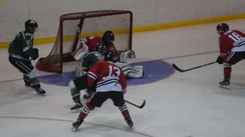 Johnson makes a third period save to keep Sarnia in the game. (photo by Jake Jeffrey)