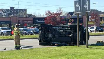 A vehicle flipped on its side in a crash on Lambton Mall Rd. May 19, 2016 (BlackburnNews.com photo by Briana Carnegie)