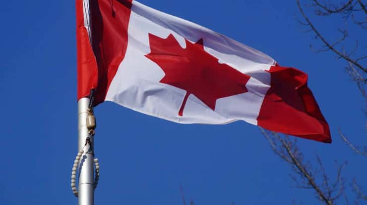 Canadian Flag at a Remembrance Day ceremony 2015. (BlackburnNews.com File Photo).
