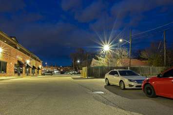 An illuminated alley and parking lot along Ottawa Street, Windsor. Photo courtesy Ottawa Street Business Improvement Association.