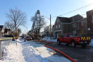 Firefighters at the scene of two house fires in the 800-block of Assumption St. in Windsor March 2, 2015. (Photo by Adelle Loiselle.)
