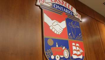 The Town of LaSalle crest hangs above the mayor's chair in Council Chambers at the LaSalle Civic Centre in this photo taken August 26, 2014. (Photo by Ricardo Veneza)