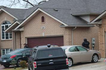 Windsor police ESU surround house in east Windsor to serve an outstanding arrest warrant, December 1, 2015. (Photo by Maureen Revait) 