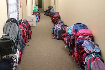 Backpacks line the halls at United Way in Chatham for operation backpack. August. 29, 2016. (Photo by Natalia Vega)