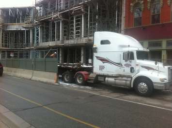 Workers unload a shipment of rebar at the downtown Chatham condo project site on January 23, 2015. (Photo by Mike James)