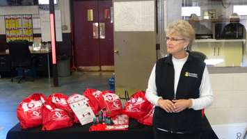 Gayle Bailey from Invisible Fence, shows off animal rescue kits that will be located at all fire stations in Chatham-Kent (Photo taken by Jake Kislinsky).