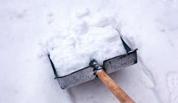 Snow shovel. © Can Stock Photo / Rosinka79