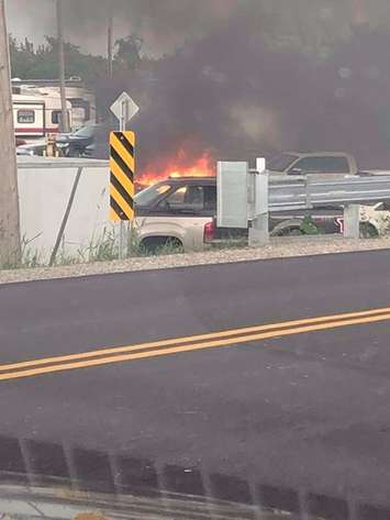 A fire is seen in the area of Tilbury Auto Sales on August 18, 2018. Photo courtesy of Clare Tellier-Washburn/Facebook.