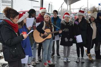 Singers perform Christmas carols at the ReMax Turkey Giveaway on Tecumseh Rd. E. in Windsor, December 20, 2018. Photo by Mark Brown/Blackburn News.