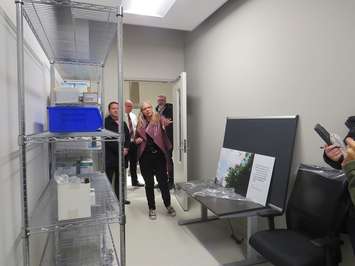 Sonja Burke, director of harm reduction services at RHAC, touring people through Carepoint. (Photo by Miranda Chant, Blackburn Media)