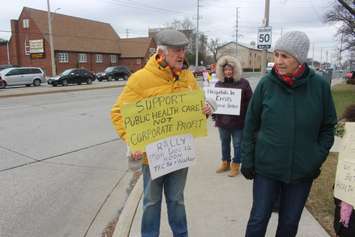 Protestors on Tecumseh Road East and Walker Road, Windsor, December 12, 2022. Photo by Mark Brown/WindsorNewsToday.ca.