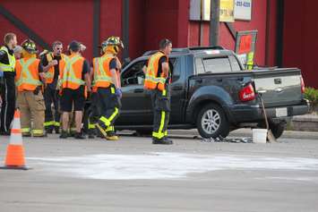 Emergency crews respond to a crash at the intersection of Huron Church Rd. and Tecumseh Rd. W, July 21, 2015. (Photo by Jason Viau)
