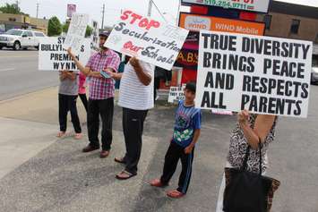 Parents and students hold a sex-ed protest outside NDP Windsor-West MPP Lisa Gretzky's office, June 5, 2015. (Photo by Jason Viau)